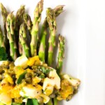 closeup of sauce gribiche with asparagus