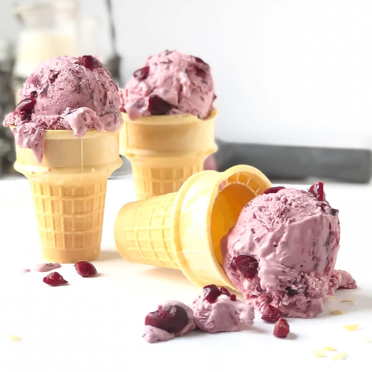 Philadelphia-style homemade sour cherry ice cream on ice cream cones