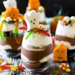 Halloween pudding cups with ghost marshmallows, pumpkin marshmallows and candy corn